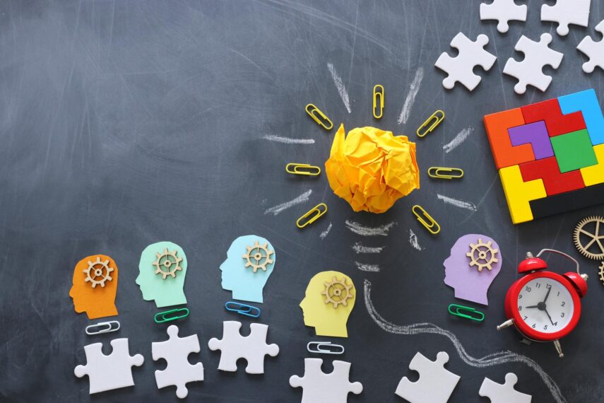 Education concept image. Creative idea and innovation. Crumpled paper as lightbulb metaphor over blackboard