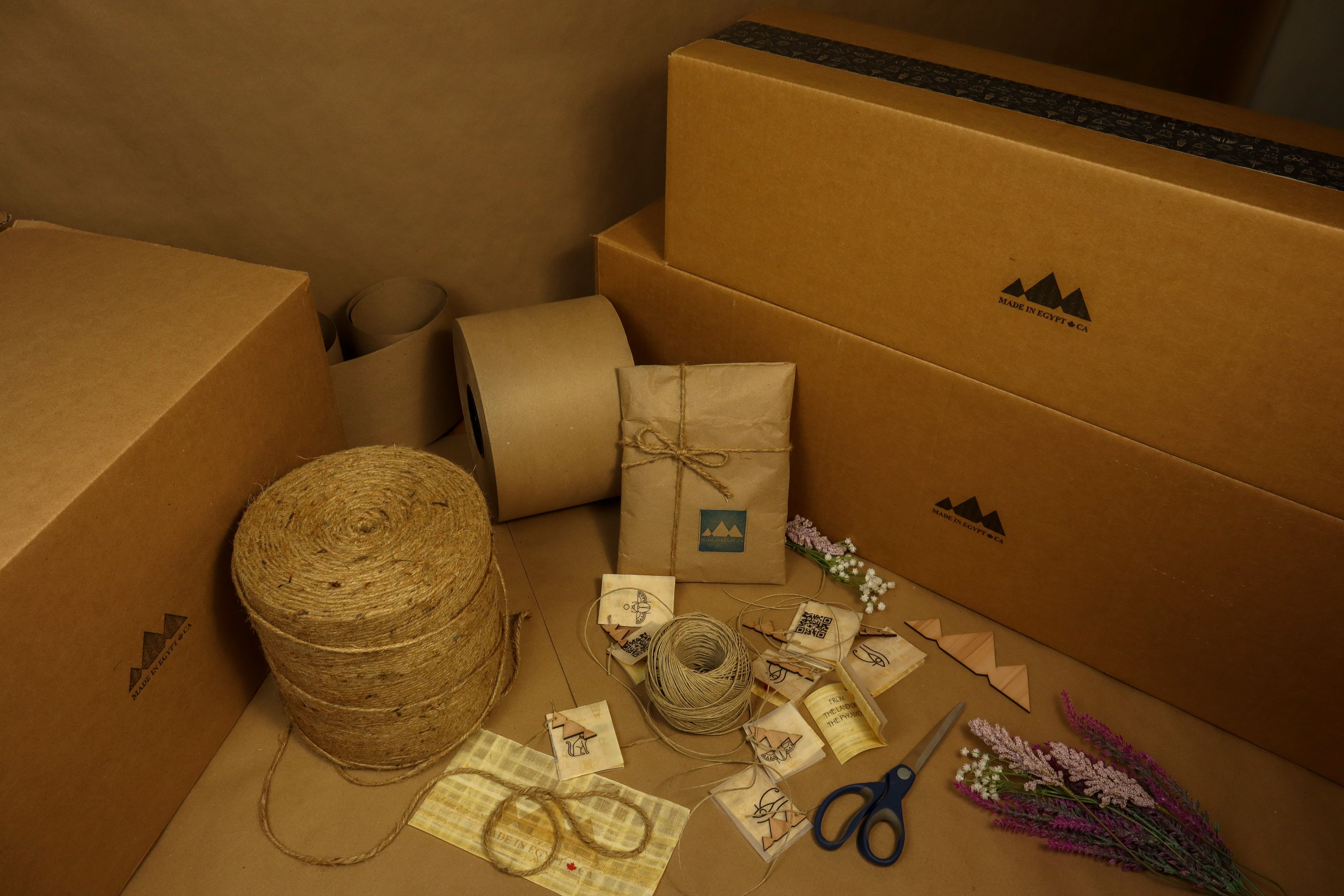 Assortment of eco-friendly packaging materials including kraft boxes and paper for sustainable shipping