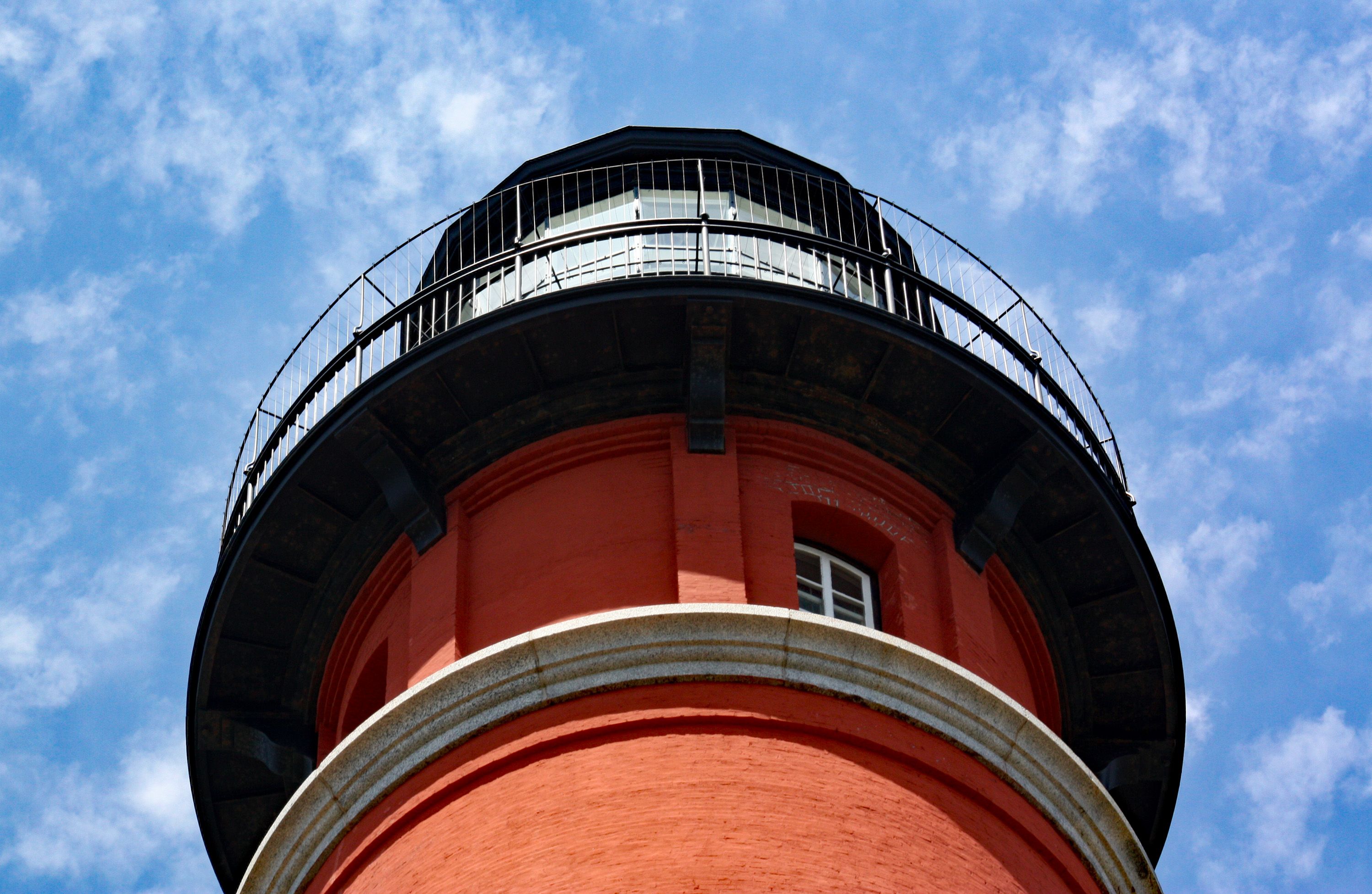 Ponce de Leon Inlet Lighthouse standing against a clear blue sky near the Florida coast